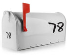 Custom vinyl mailbox numbers in bold font on a white mailbox