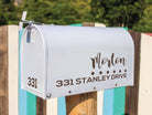 Close-up of personalized mailbox sticker in classic script