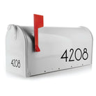 Self-adhesive mailbox numbers for easy application