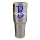 Personalized vinyl monogram decal with print-style initial and name for tumblers and flat surfaces.